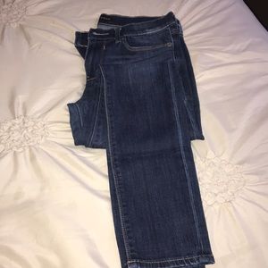 Express medium blue mid rise jean legging. Size 4R